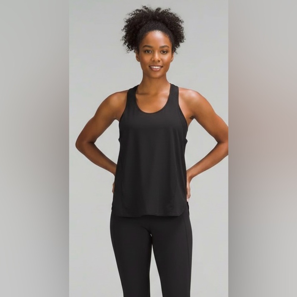 Lululemon black racerback workout top, oval hem, side slit, great condition, 4